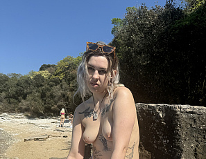 050325_sam_big_boobs_masturbating_on_a_public_beach_with_her_friends_naked_in_the_background