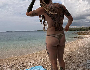 052326_brille_enjoying_a_nude_beach_afternoon_applying_sun_tan_oil_masturbating_and_eating_lunch